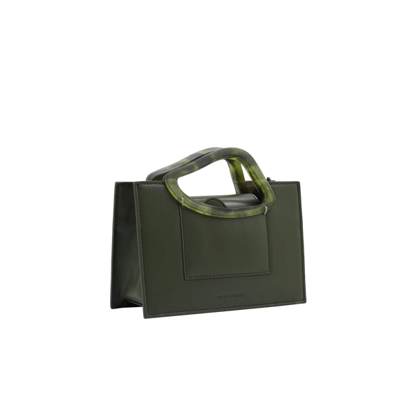 Rectangle shaped olive calf leather saddle bag with natural resin handle holder and remowable calf leather handle strap on a white stand